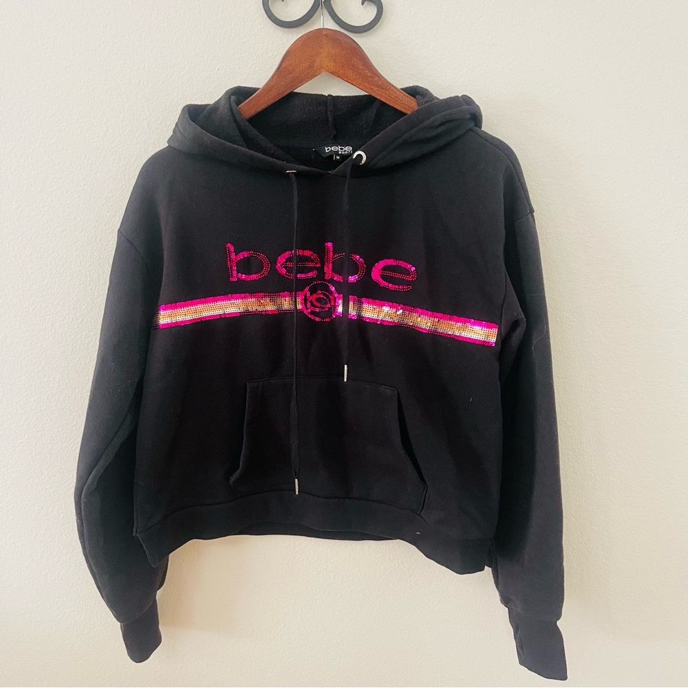 Bebe sequenced sweatshirt with hood.